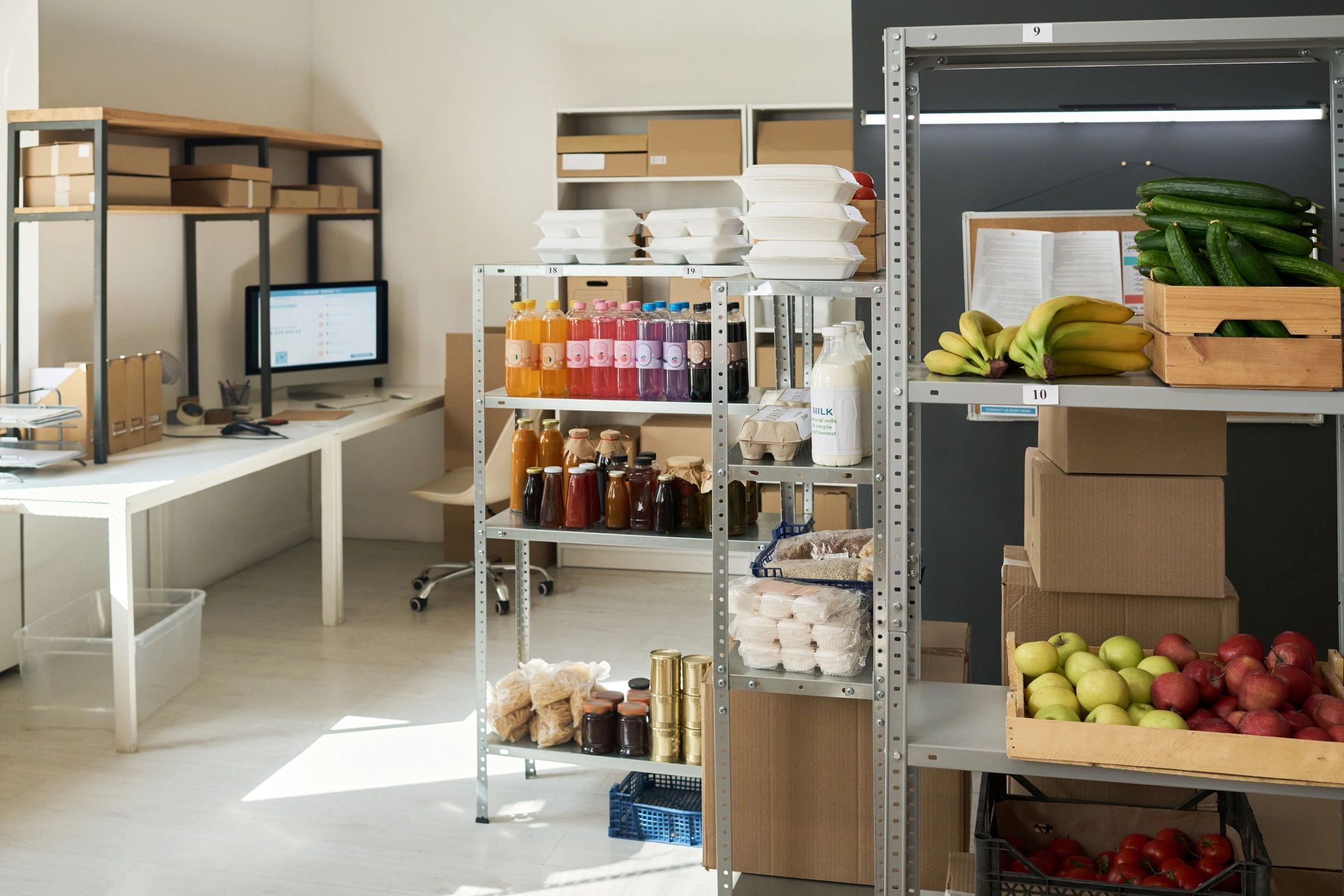 Grocery order pickup area with packed boxes and food items